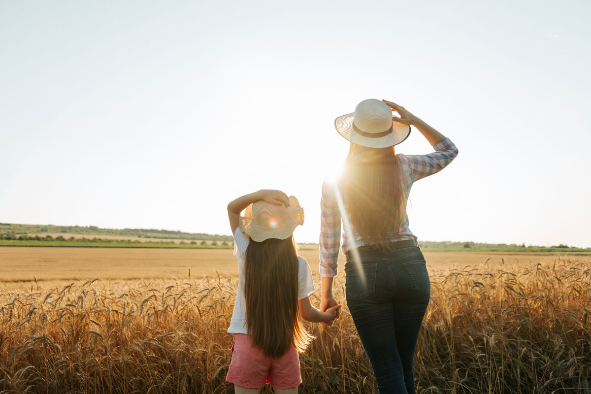 woman and girl in a field